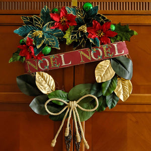 Lower half of wreath is decorated with magnolia leaves in green and bronze.