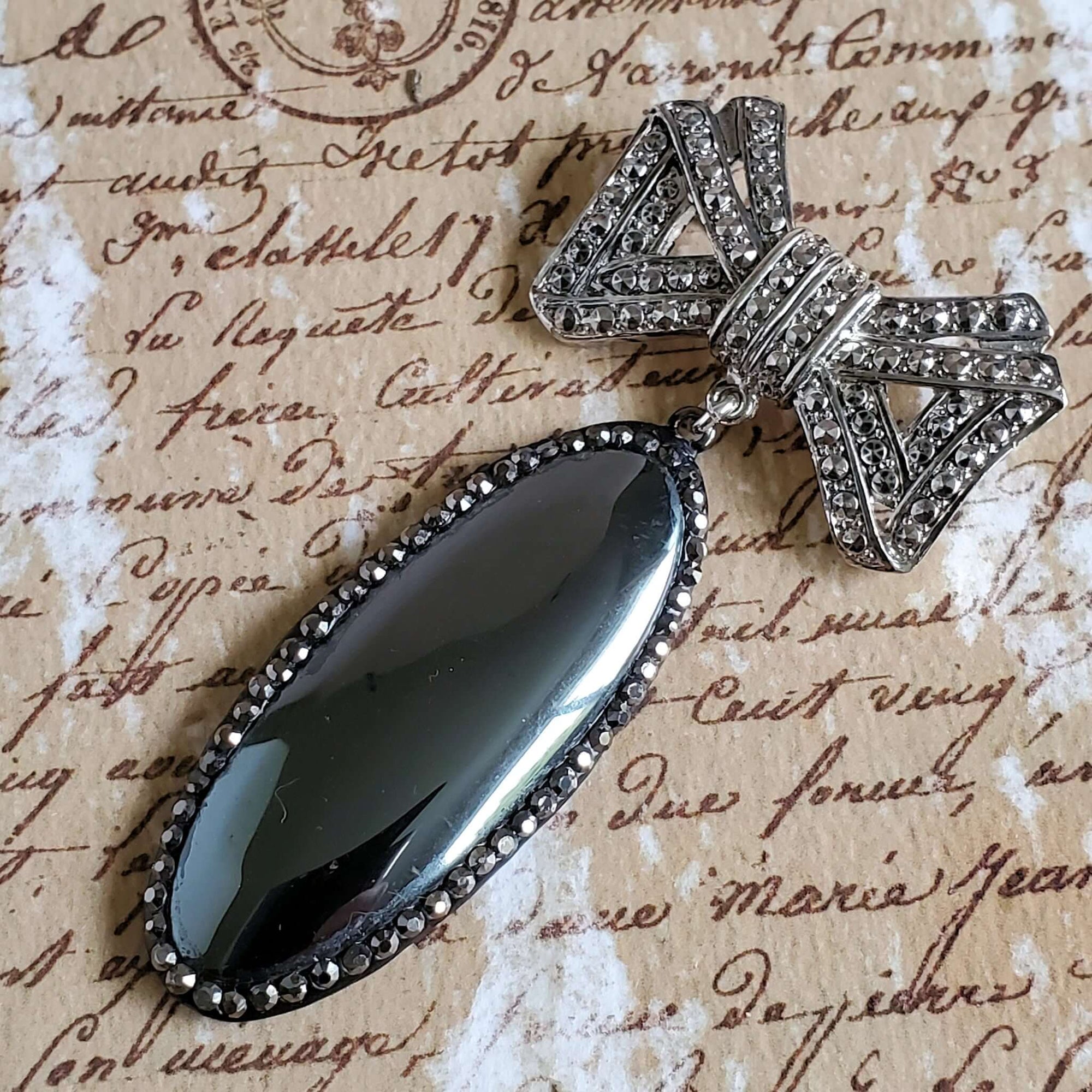 Marcasite Bow Brooch with Large Oval Mirror Stone