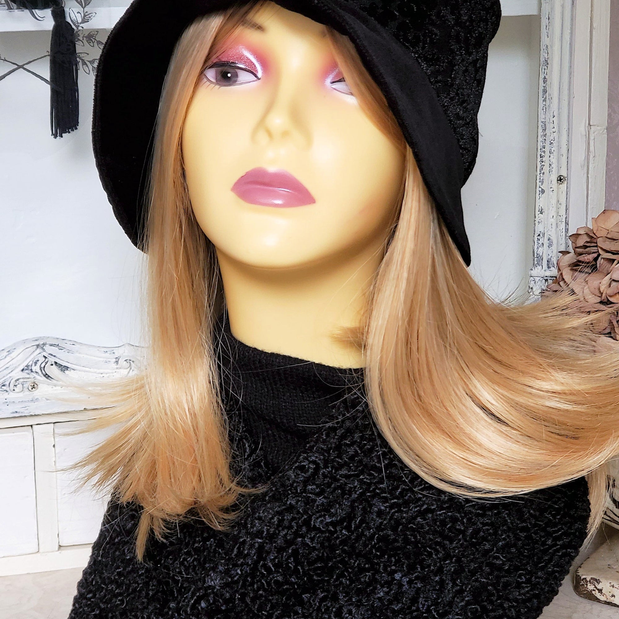 Mannequin wearing the black burnout velvet cloche hat and the matching scarf, showing the faux Persian lamb fabric.