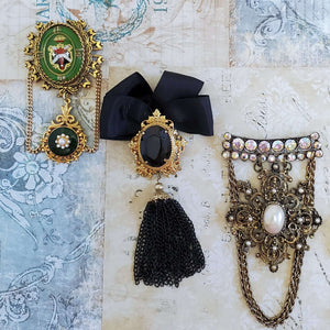 Romance and Ruin Brooch collection featuring three handmade brooches