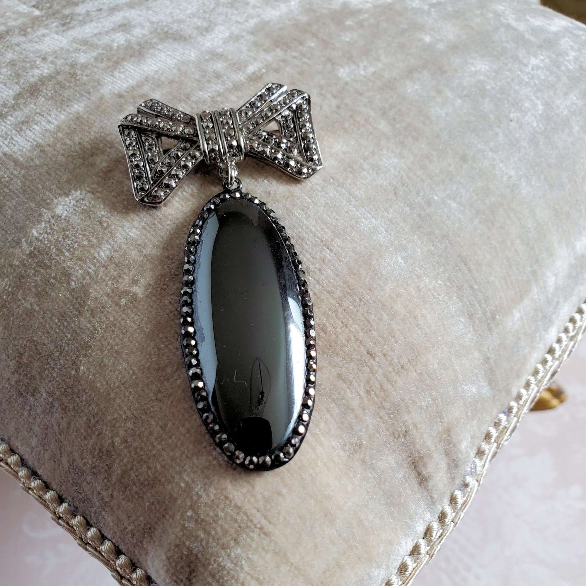 Marcasite Bow Brooch with Large Black Oval Stone Pendant