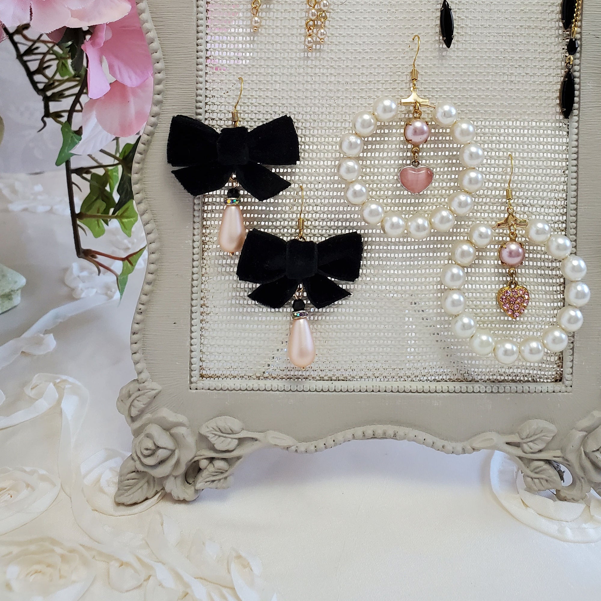 Pearl and black bow earrings
