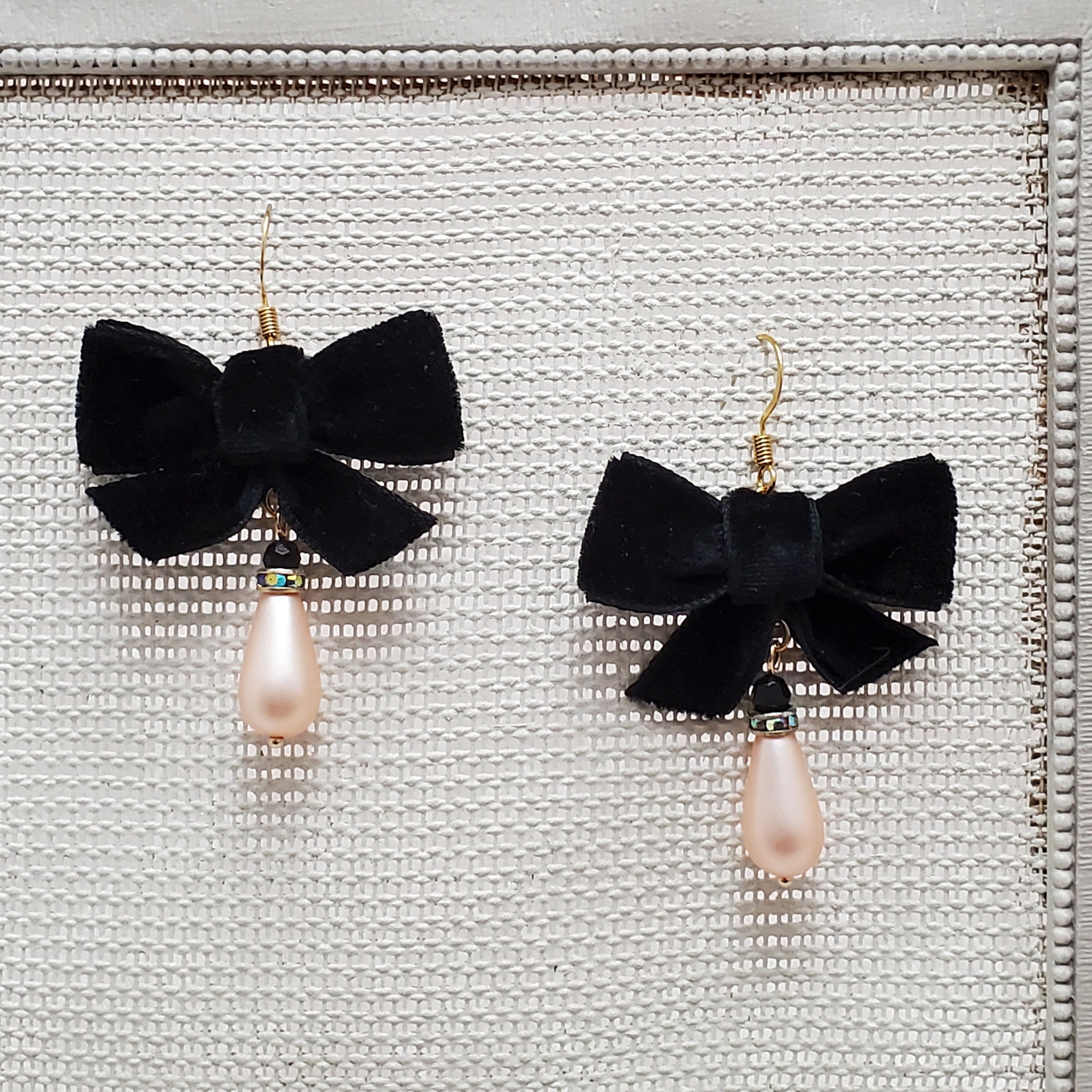 Black bow earrings with pink pearl drop 