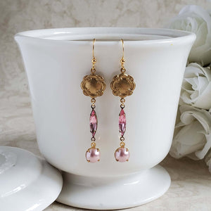 Three tier earrings with a brass floral etched round charm, a vintage rose crystal  and a blush pearl drop.