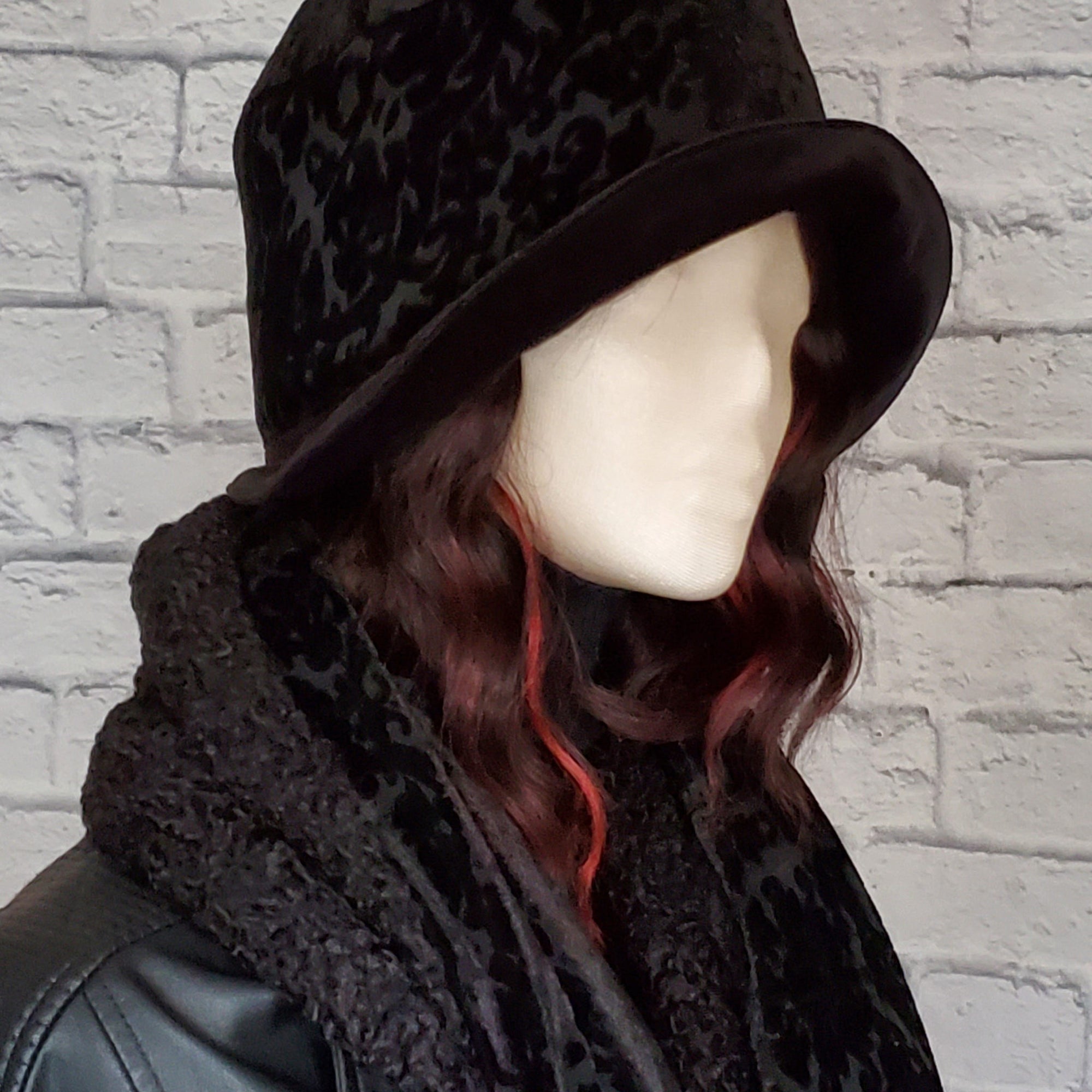 Black winter Hat and Scarf Set includes a a black damask burnout velvet cloche that is fully lined . The hat is paired with a reversible matching black scarf with one side finished in a faux Persian lamb  and the other side in a black burnout velvet.