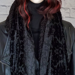 Black reversible scarf in  a burnout velvet and faux Persian lamb.
